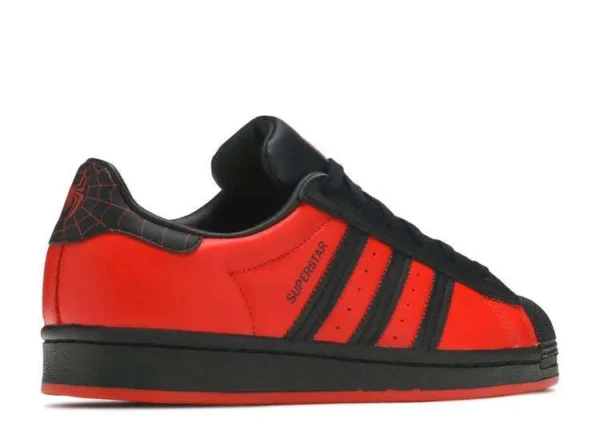 adidas-superstar-marvel-playstation-spiderman-miles-morales-2.webp ADIDAS SUPERSTAR MARVEL PLAYSTATION ‘SPIDERMAN MILES MORALES’