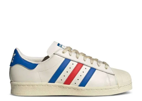 adidas-superstar-white-blue-red.webp ADIDAS SUPERSTAR ‘WHITE BLUE RED’